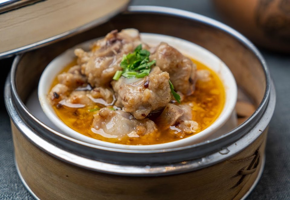 Menu page with dim sum and noodle dishes.