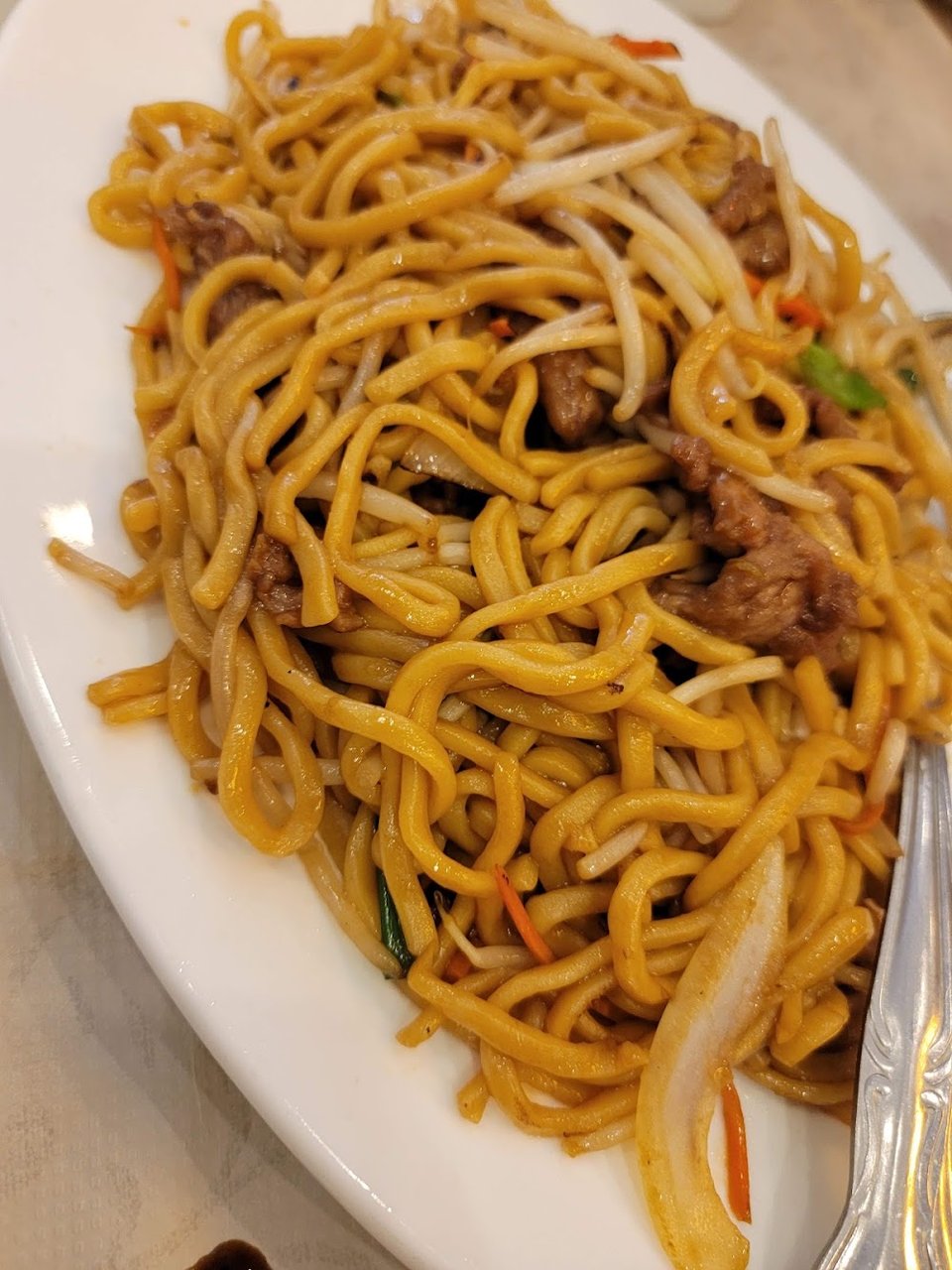 Menu page with dim sum and noodle dishes.