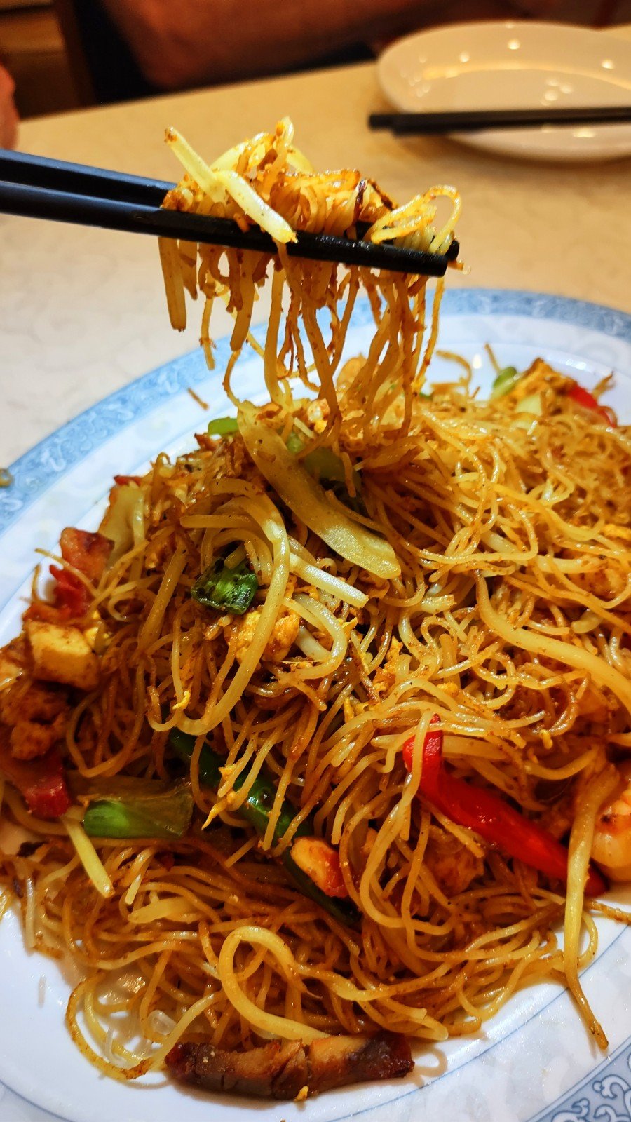 Menu page with dim sum and noodle dishes.