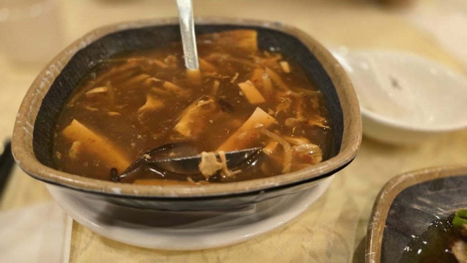 Menu page with dim sum and noodle dishes.